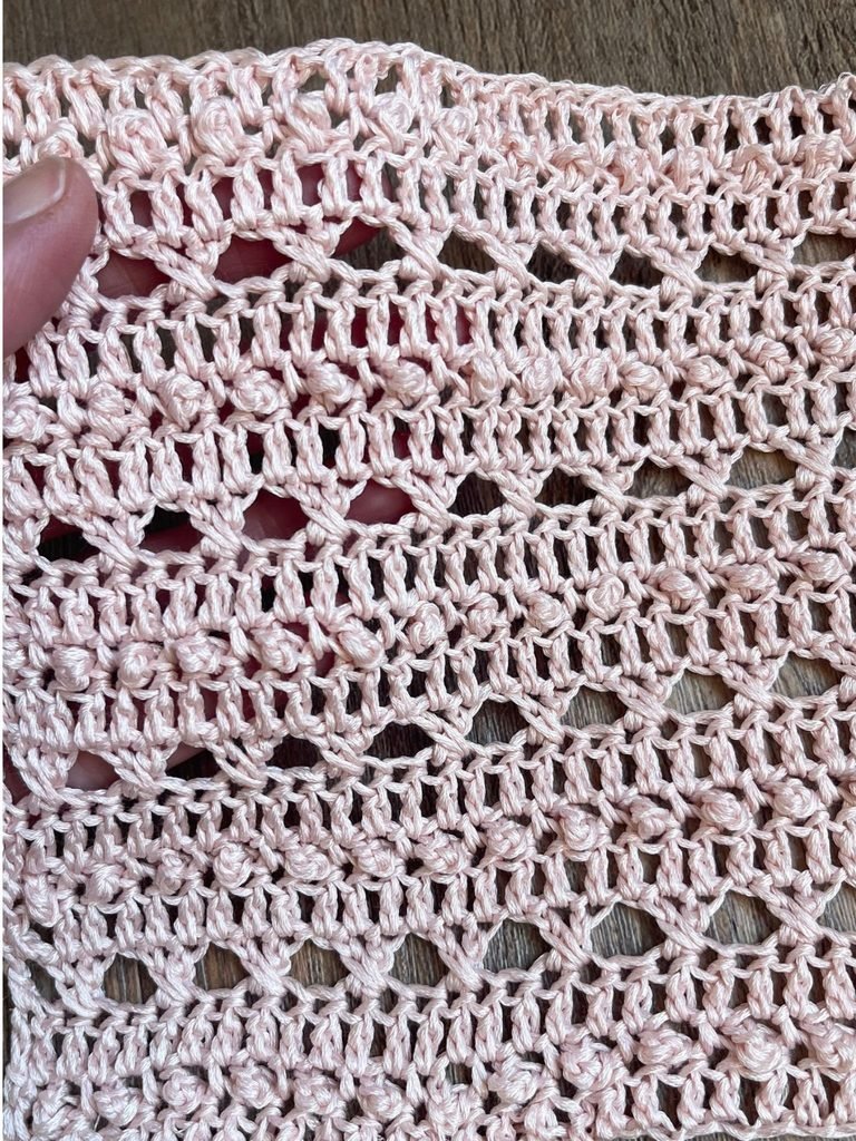 Crochet swatches worked in the same stitch in cotton, linen, bamboo and angora